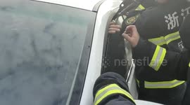 Firefighters free motorist's hand stuck in car window in eastern China