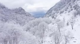 Mountains blanketed in snow as winter conditions grip northern China