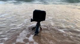 GoPro action camera recording videos, timelapse and taking pictures of the sand and ocean waves on the shore of Bahia de Kino beach, Sonora, Mexico