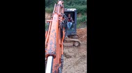 Man using excavator crane as the selfie photography tool