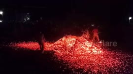 Chinese villagers run barefoot over burning coal at festival to ward off evil spirits
