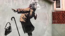 Banksy painting on wall of house in Bristol