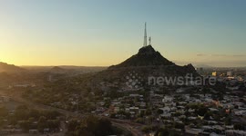 Aerial view of Cerro de la Campana at sunset and the Hacienda de La Flor, Revolucion colonies on December 10, 2020 in Hermosillo, Mexico. .