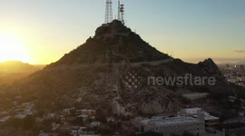 Aerial view of Cerro de la Campana at sunset and the Hacienda de La Flor, Revolucion colonies on December 10, 2020 in Hermosillo, Mexico. .