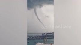 Dramatic waterspout forms off the coast of Singapore
