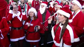 ARCHIVE: Many Santa Clauses perform music at Christmas tree on Trafalgar Square, London, UK