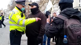 Tensions flare as anti-lockdown protesters face off with poice outside Downing Street