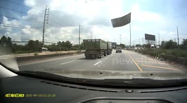 Loose metal sheet flies into car's windscreen in Thailand
