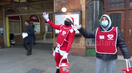 Carol busking for charity at Earls Court in London during coronavirus pandemic
