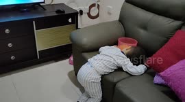 Funny toddler falling asleep while eating