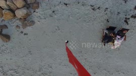 Watch as drone delivers marriage proposal directly to a couple on a beach at Cape Cod