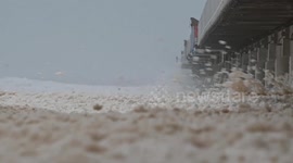 Watch as huge waves blow sea foam onto Australian Gold Coast during cyclone strength winds