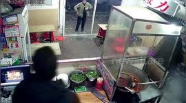 Restaurant's glass door shatters after man walks straight into it in central China