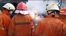 Firefighters flee burning building after septic tank explodes in Indonesia