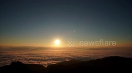 Pretty sunrise above sea of clouds in southwestern China