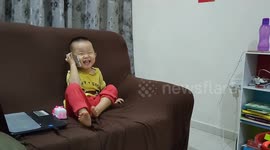 Hilarious toddler fake chatting on phone