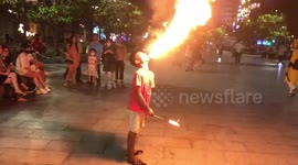 Homeless child blows a dangerous fire to ask for money in Vietnam