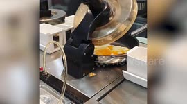 Robots cook rice in just 20 seconds at futuristic cafe in Singapore