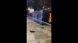 Police riot van tips over at London Wall roundabout
