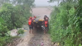 Families rescued after heavy rain causes river to swell in Philippines