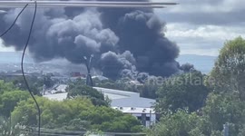 Smoke billows from recycling warehouse fire in Brisbane, Australia