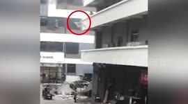 Chinese woman miraculously survives after being hit by iron bed frame thrown out of building