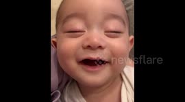 This adorable baby smiling in his sleep will melt your heart