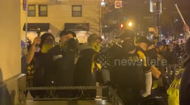 Proud Boys yell at Antifa from across police lines in DC