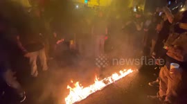 Proud Boys chant 'USA' as they burn Black Lives Matter banner in DC
