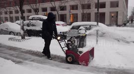 Snow blowers and shovels out in force as New York City combats winter weather