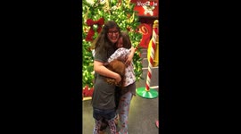 Girls unwrap their big sister as part of emotional Christmas reunion at Florida's Disney World