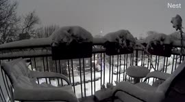 Timelapse of snow dumped on balcony as winter conditions grip New York City