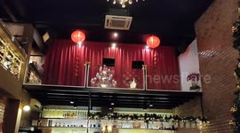 This cafe in Malaysia is decorated with 02 storey height Christmas Tree