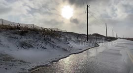Watch as drivers risk the flooded coastal roads of Long Island after winter storm Gail has passed