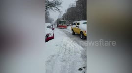 Winter Service Vehicle (WSV) is in the process of removing snow blocking the streets of New York