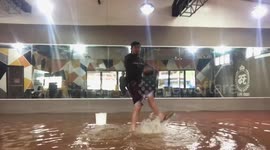 Dancer practices moves in flooded studio during Tropical Depression Vicky in Philippines
