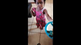 A girl who is scared to eat her food she thinks that no one eats that