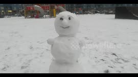 Children made snowmen over night after snowfall in St Petersburg, Russia