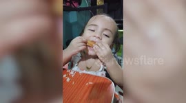 Adorable toddler keeps falling asleep while eating her favourite food