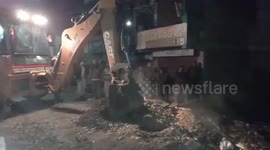 Buffalo rescued by police officials from deep pit in central India