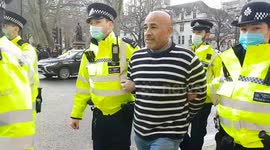 CORRECTS DATE: Demonstrator arrested at London anti-lockdown protest before event began