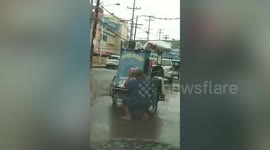 Cab Driver Puts Face Mask And Rain Jacket On Pet Dog