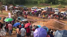 Vehicles Race Over Muddy Track At Off-Road Competition In Vietnam