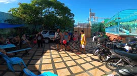 Filipino man falls off chair during hilarious Christmas party game