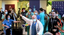 Israeli hospital staff celebrate after giving first COVID-19 vaccines