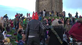 Hundreds gather to celebrate Winter Solstice on Glastonbury Tor in UK
