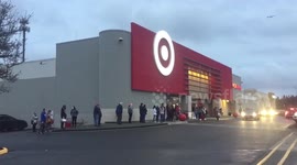 Last minute Christmas Shoppers line up outside stores