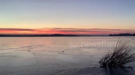 US: Cold Seasonal Weather Freezes Lake In Minnesota