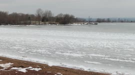 US: Ice Fishing At Frozen Lake Superior