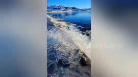 Sound on! Sheets of ice washing up from Chinese lake makes intense crackling noise